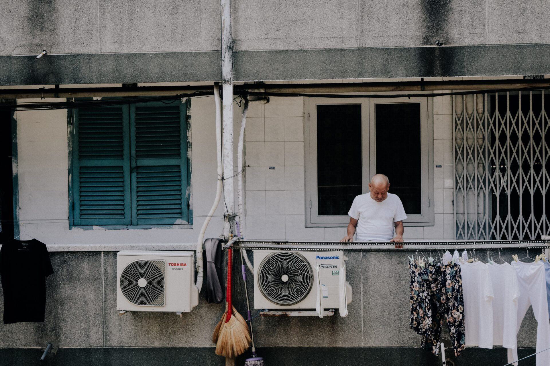 man standing outside near a/c