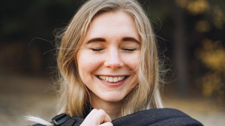 woman breathing with eyes closed